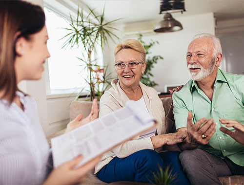 Older couple meeting with a financial advisor
